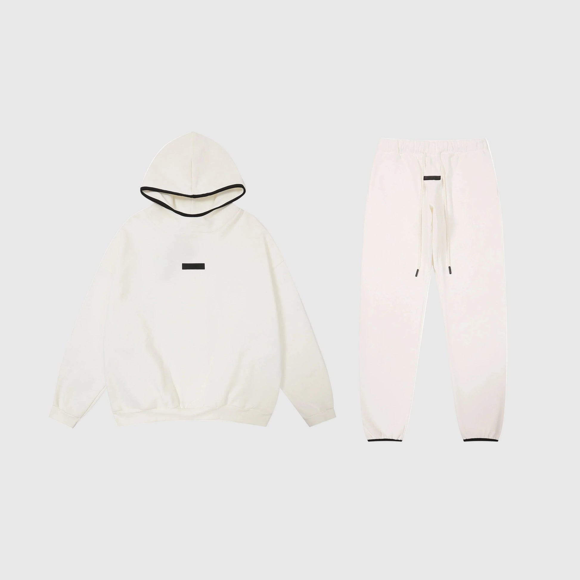 Essentials eggshell cozy fleece tracksuit set with relaxed fit by Fear Of God