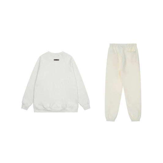 Essentials tracksuit cloud dance angled view relaxed fit crewneck set