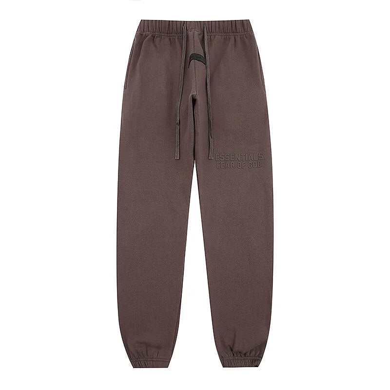Congo brown Essentials joggers soft-touch rubberized logo on leg close-up