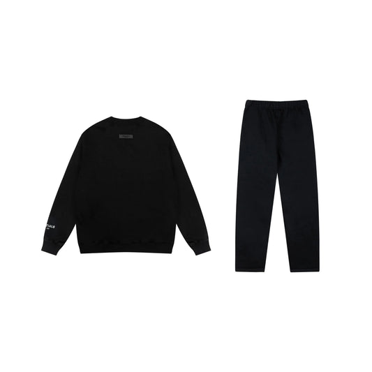 Essentials tracksuit black angled view relaxed fit crewneck set