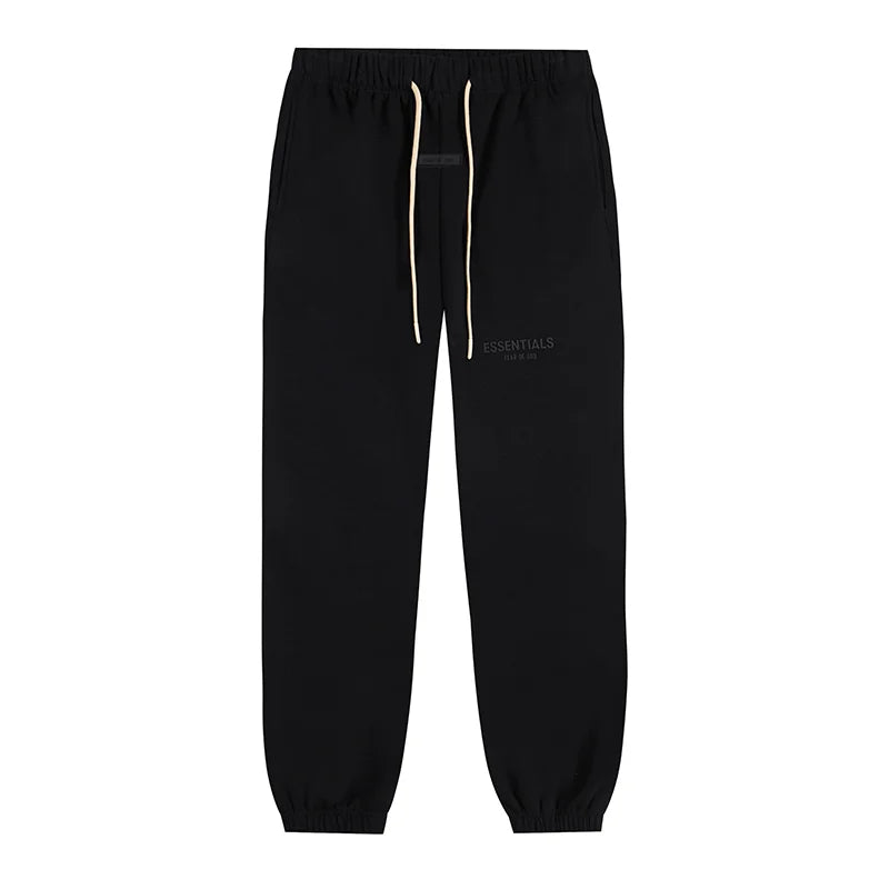 Back view of Essentials black core fleece tracksuit set by Fear Of God