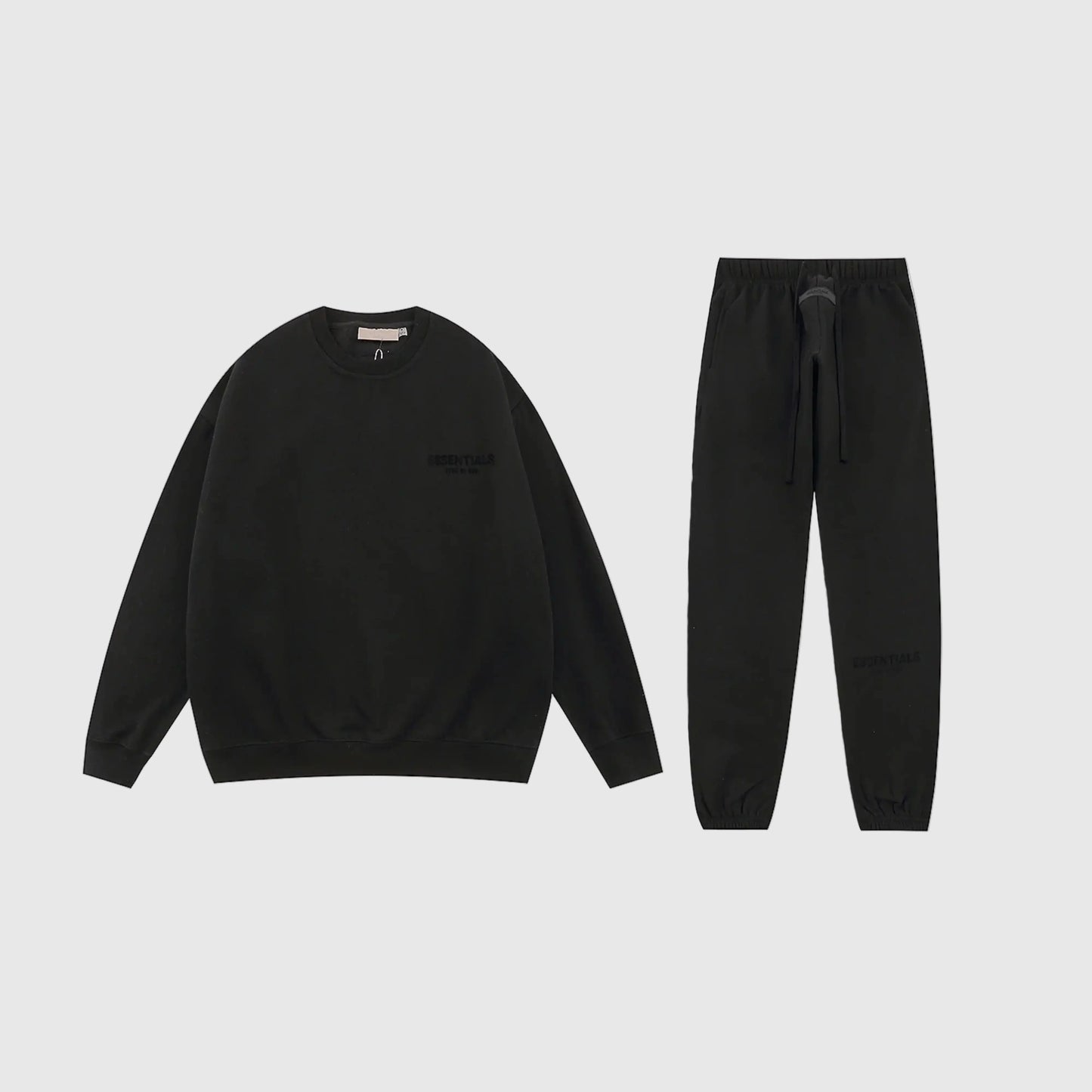 Essentials black fleece hoodie with soft interior detail by Fear Of God

