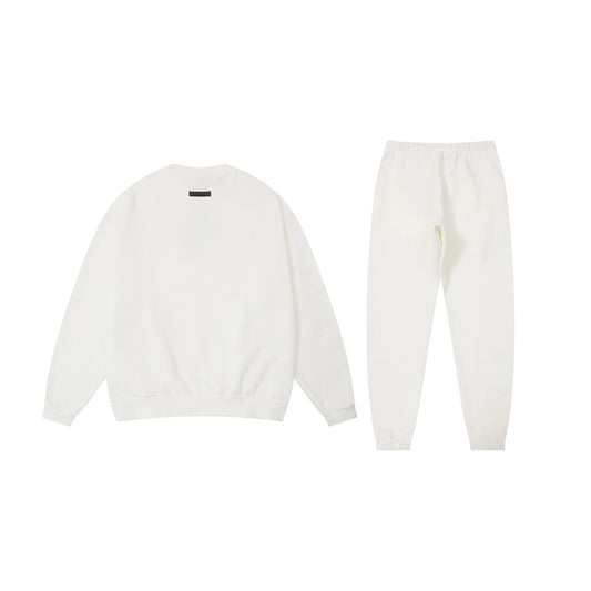 Essentials eggshell relaxed fleece hoodie with soft interior detail by Fear Of God