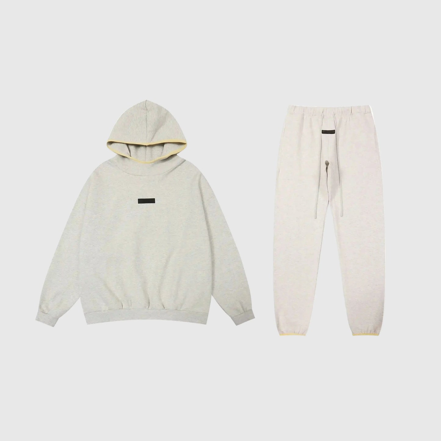Essentials light heather oatmeal fleece tracksuit set by Fear Of God front view