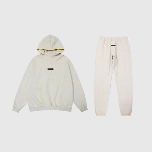 Essentials light heather oatmeal fleece tracksuit set by Fear Of God front view