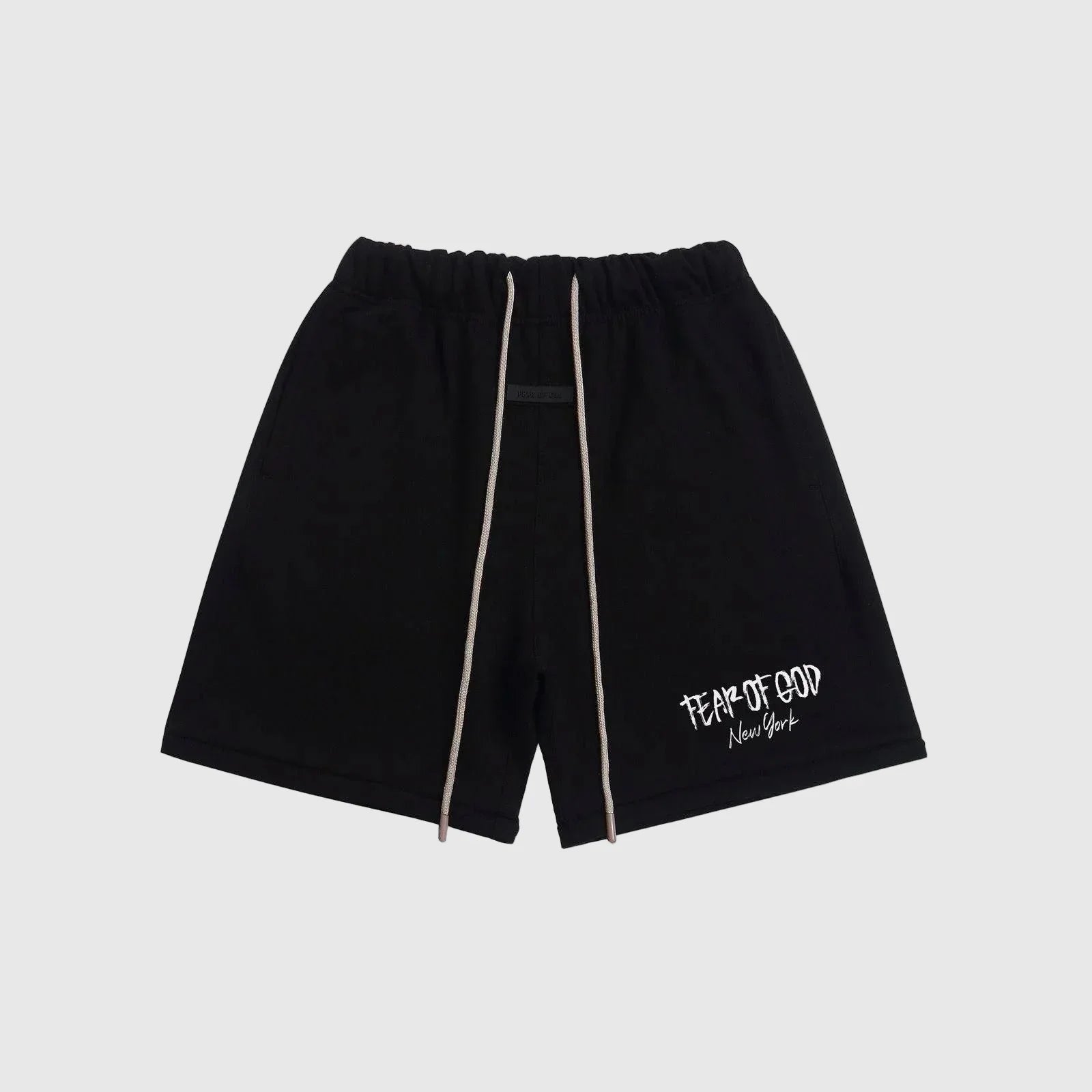 Fear of God Essentials black sweatshorts with drawstring waistband and logo detailing.