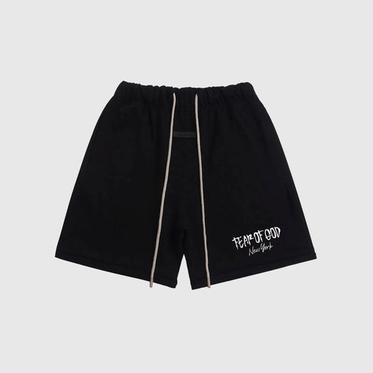 Fear of God Essentials black sweatshorts with drawstring waistband and logo detailing.