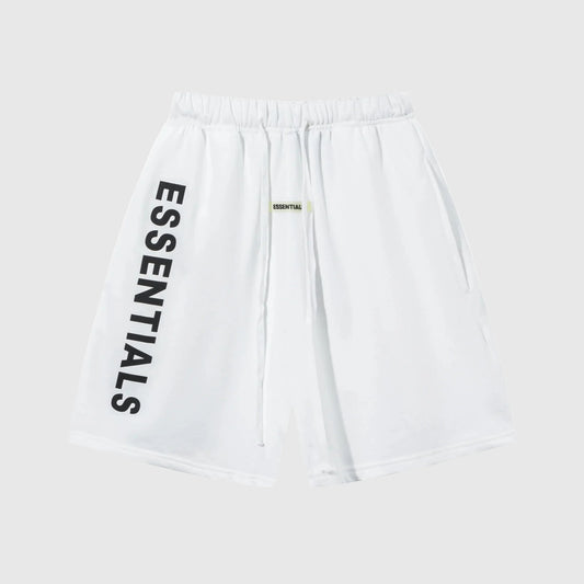 Model wearing Fear of God Essentials Eggshell Beige Shorts, showing relaxed fit and subtle ESSENTIALS logo detail.