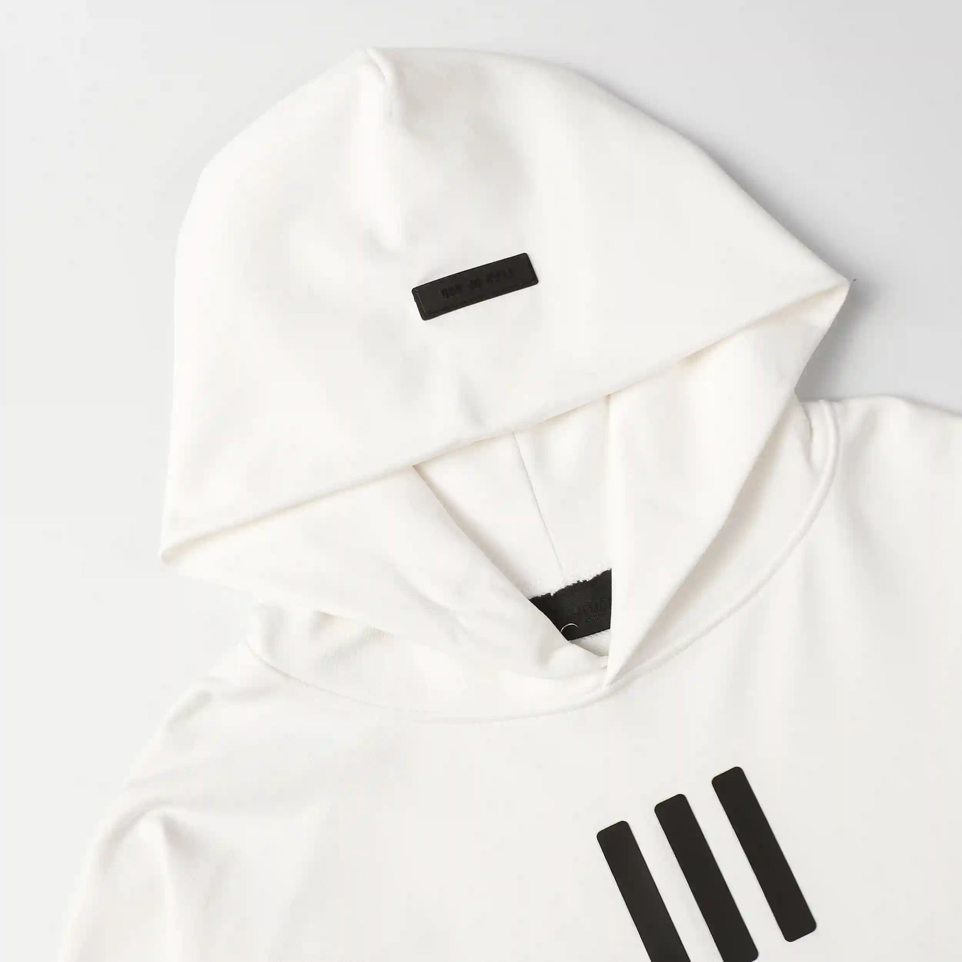 essentials eggshell hoodie front view minimalist design
